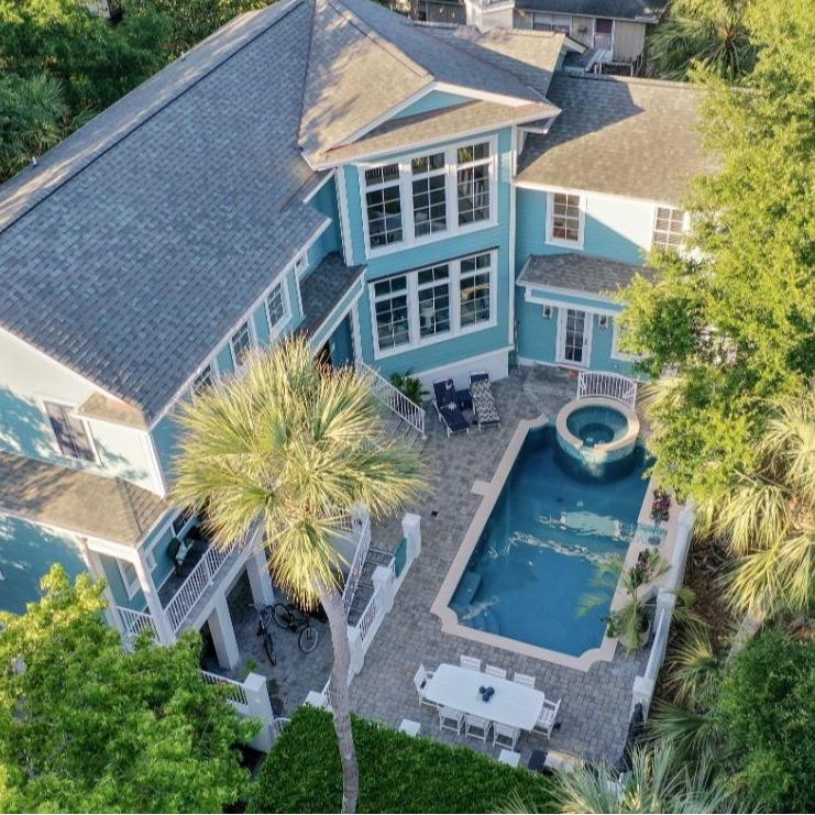 aerial view of luxury vacation home with pool